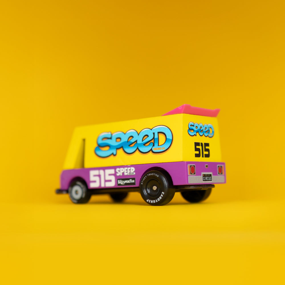 Quarter back angle of Speed Vandal Toon car against yellow background