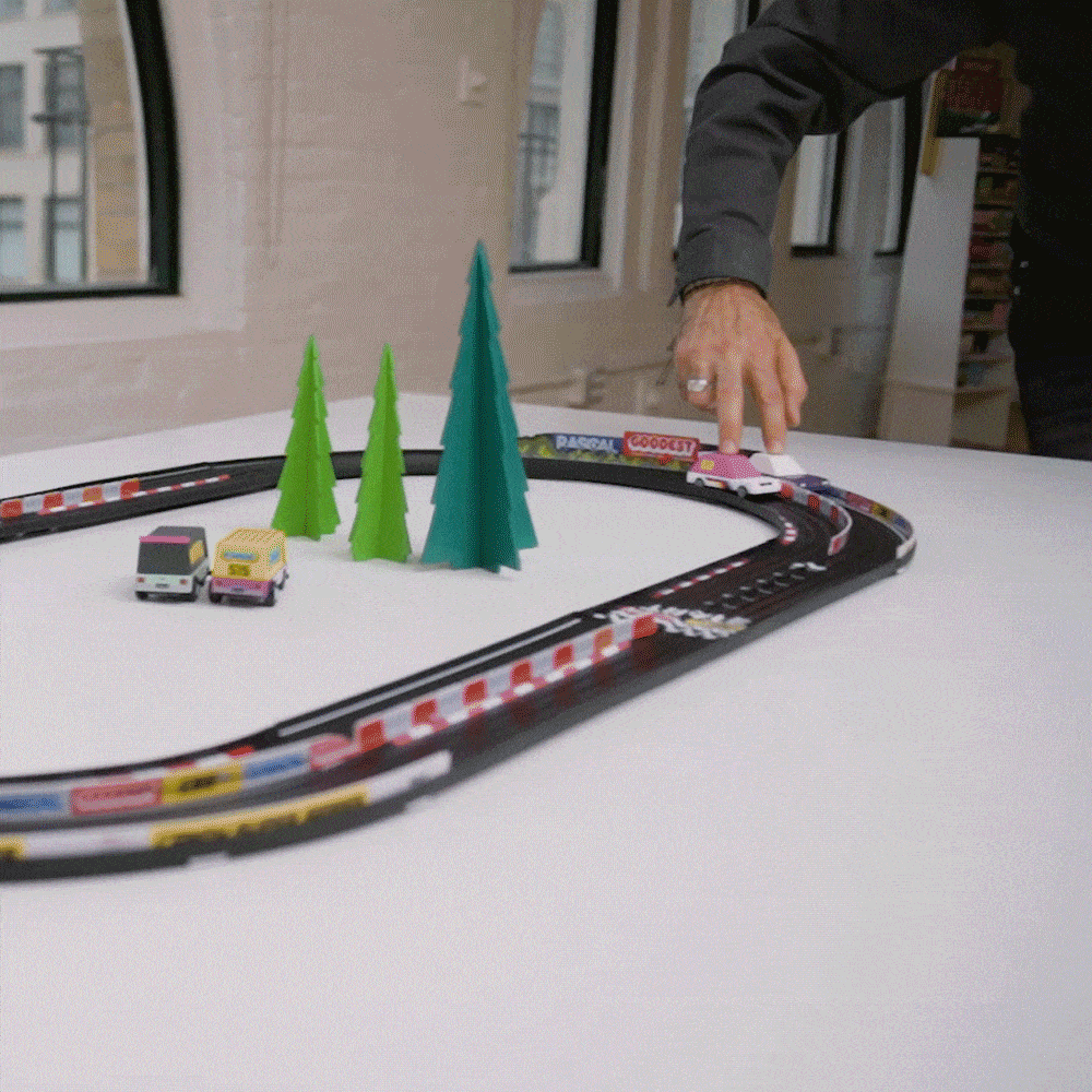 GIF of Toons driving on Oval Playset